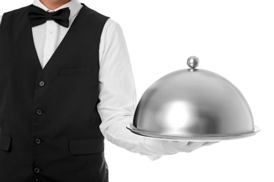 Waiter holding metal tray with lid on white background, closeup