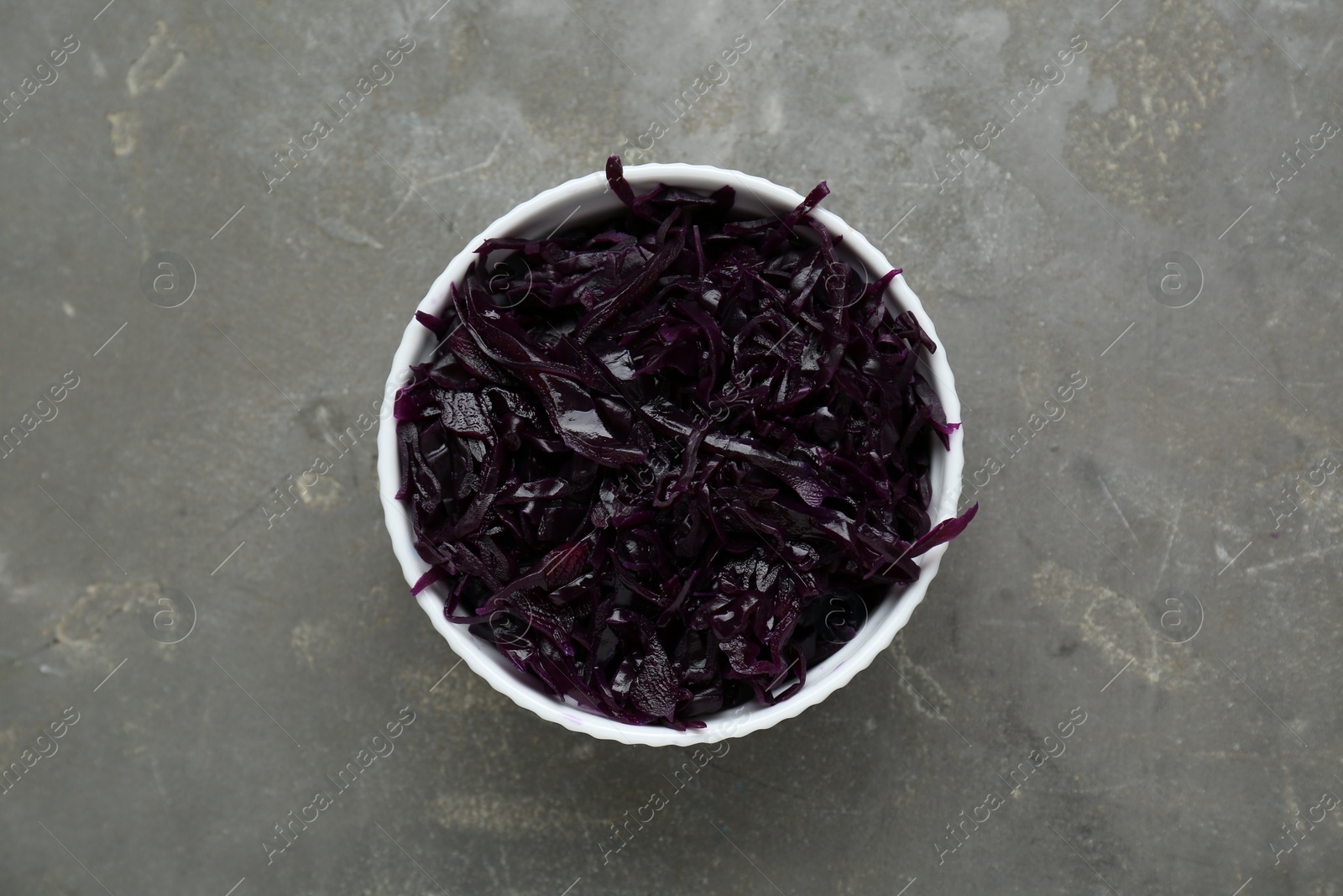 Photo of Tasty red cabbage sauerkraut on light grey table, top view