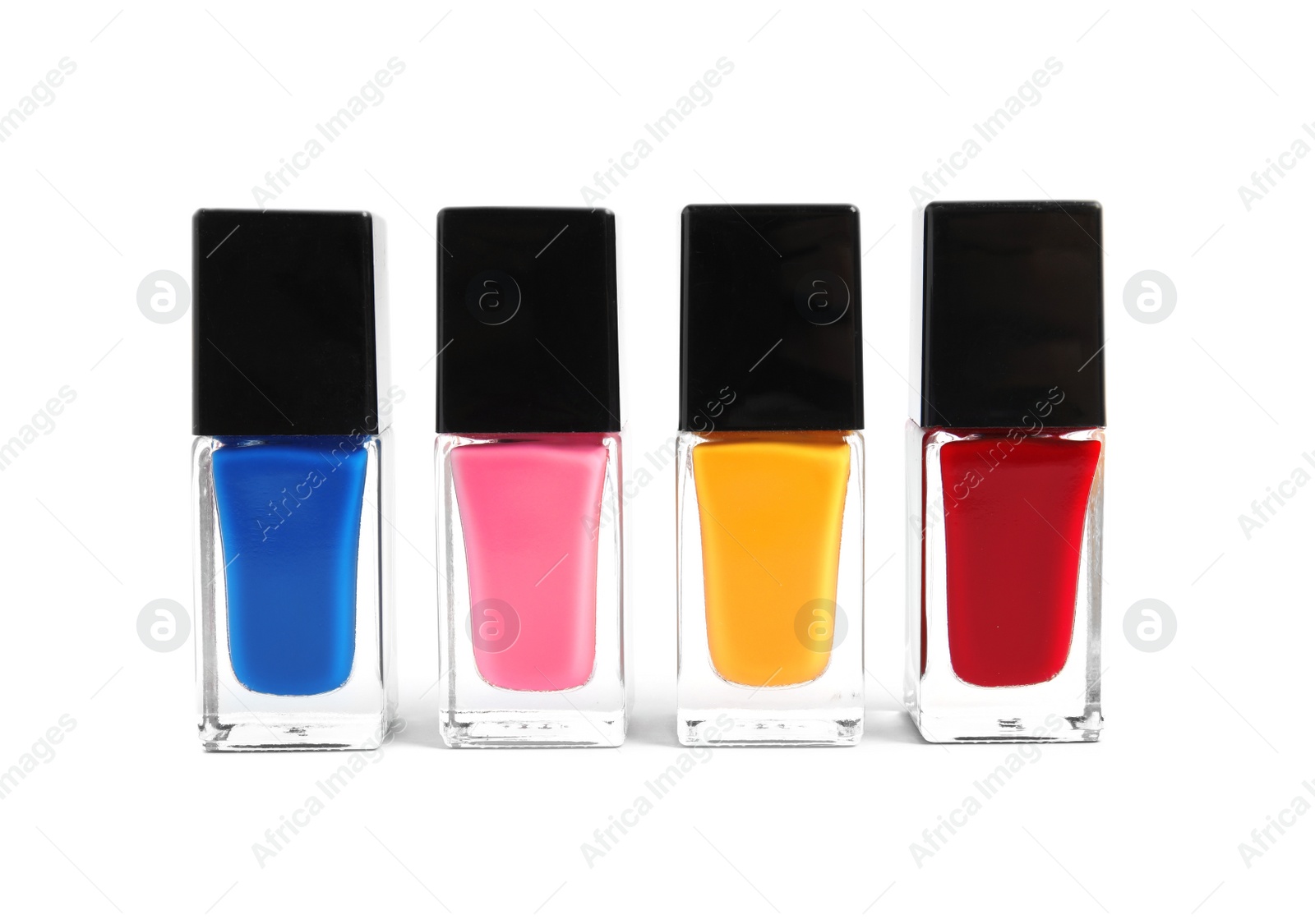 Photo of Bottles of nail polish on white background