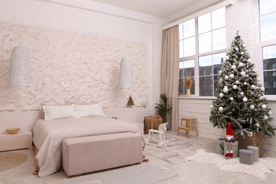 Photo of Bedroom interior with Christmas tree and festive decor