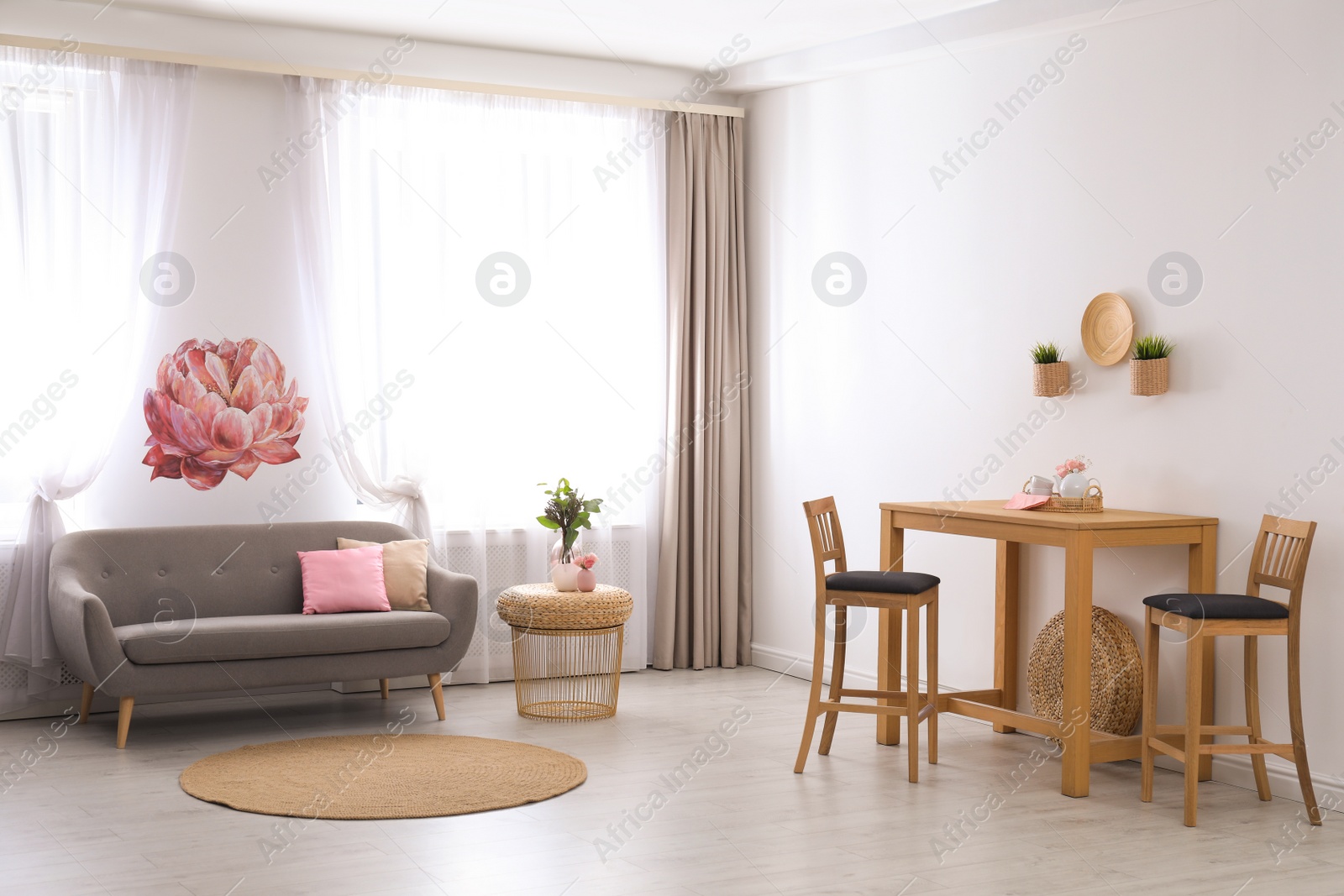 Photo of Stylish light room interior with comfortable furniture