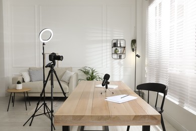Photo of Ring light, camera and microphone for blogging in room