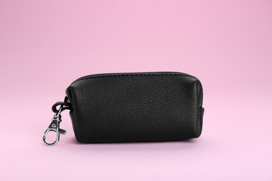 Photo of Stylish leather keys holder on pink background
