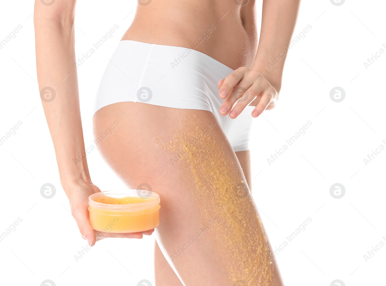 Photo of Young woman applying natural scrub on her body against white background