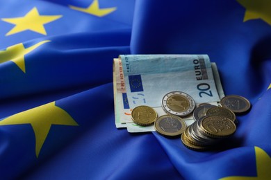 Photo of Coins and banknotes on European Union flag
