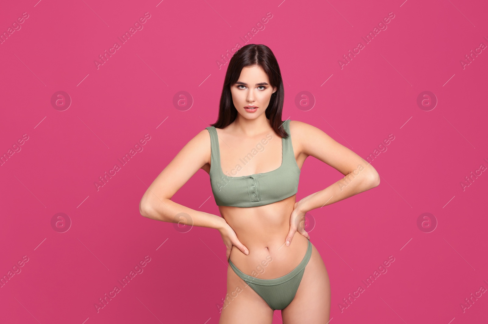 Photo of Beautiful woman in stylish bikini on pink background