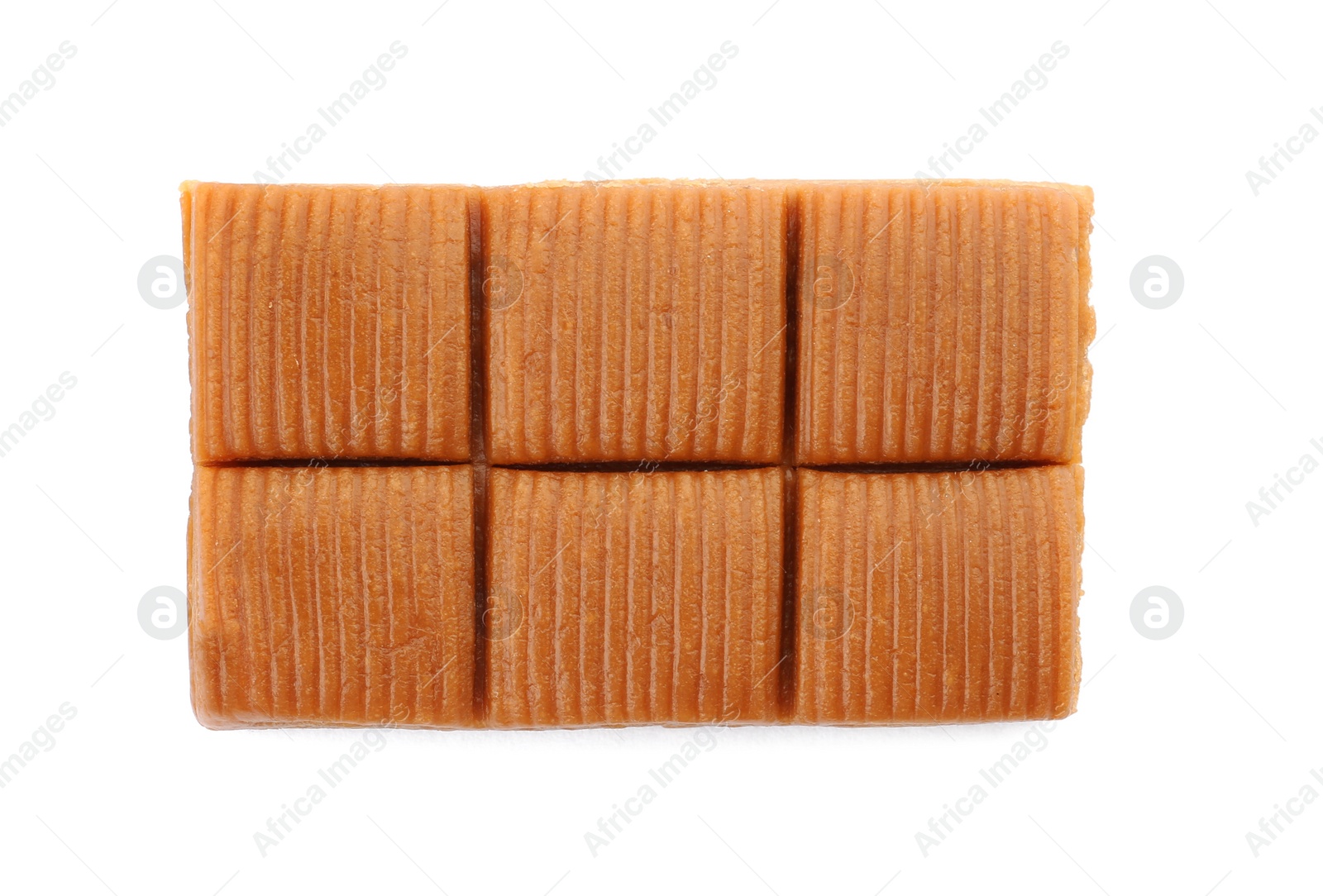 Photo of Delicious caramel candies on white background