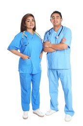 Photo of Full length portrait of Hispanic doctors isolated on white. Medical staff