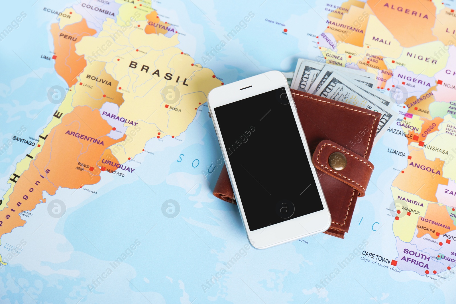 Photo of Smartphone and money on map, space for text. Travel agency