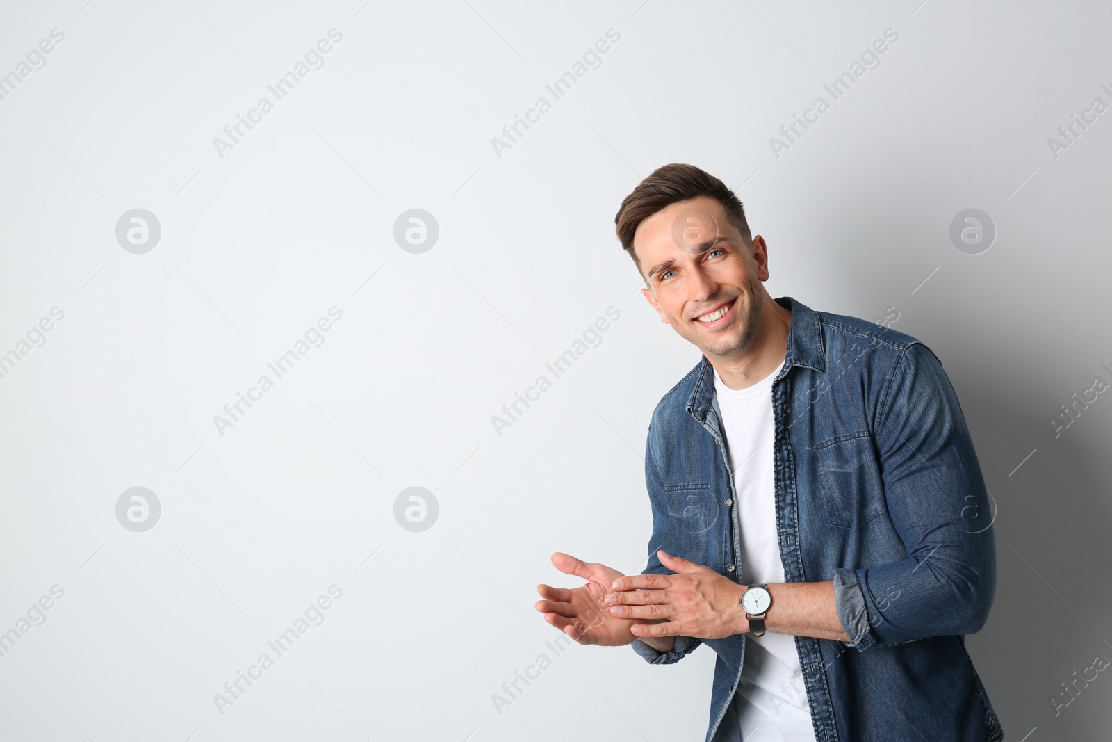 Photo of Portrait of handsome man on light background. Space for text