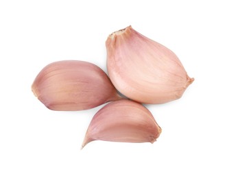 Photo of Cloves of fresh garlic isolated on white, top view