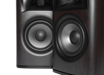 Photo of Modern wooden sound speakers on white background, closeup