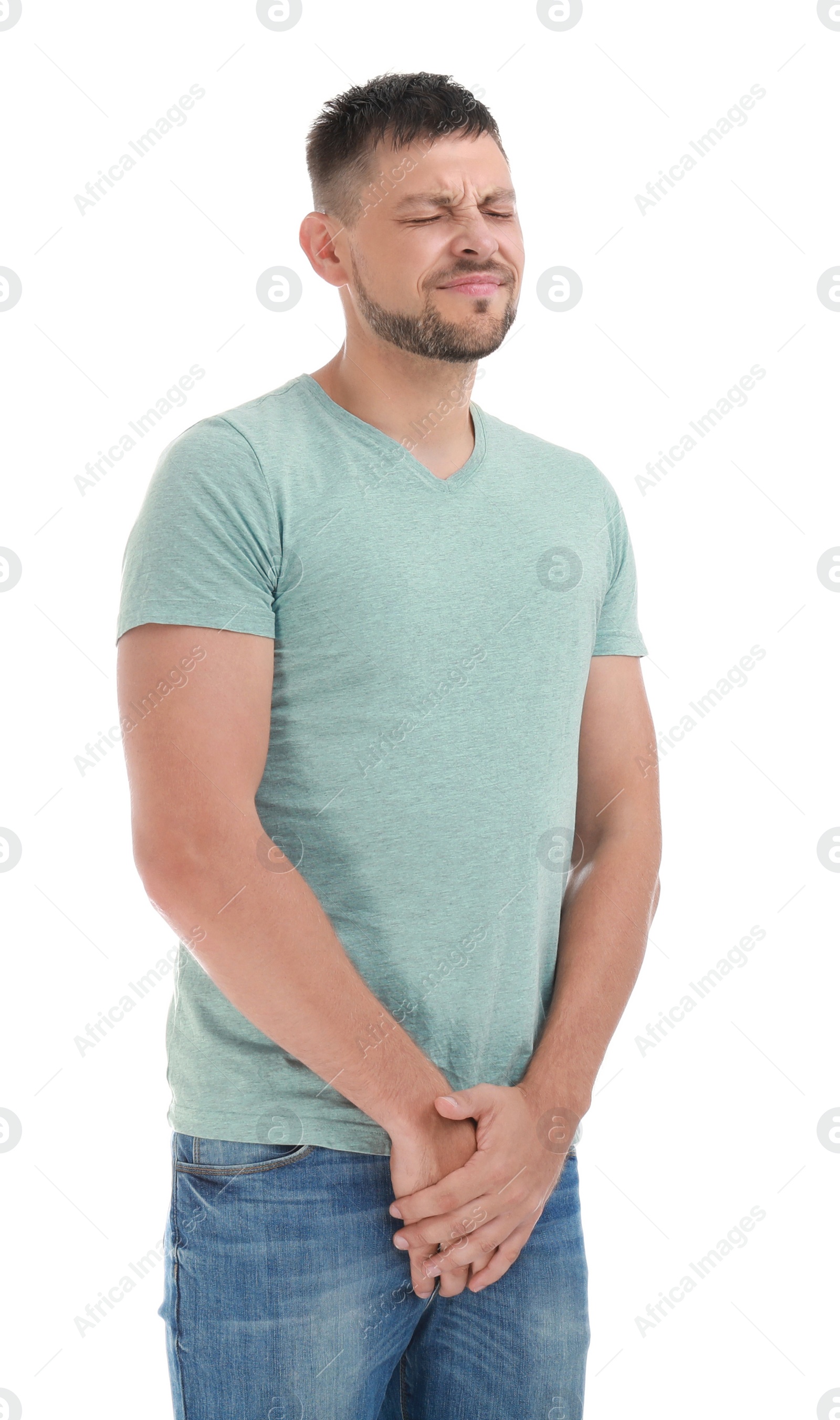 Photo of Man suffering from pain on white background. Urology problems