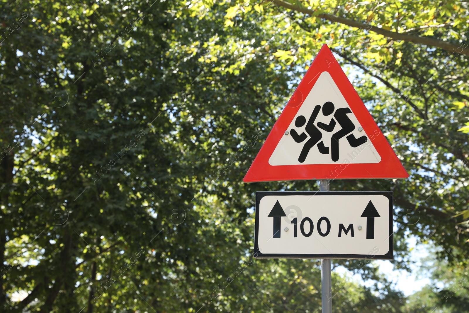 Photo of Post with traffic signs outdoors on sunny day