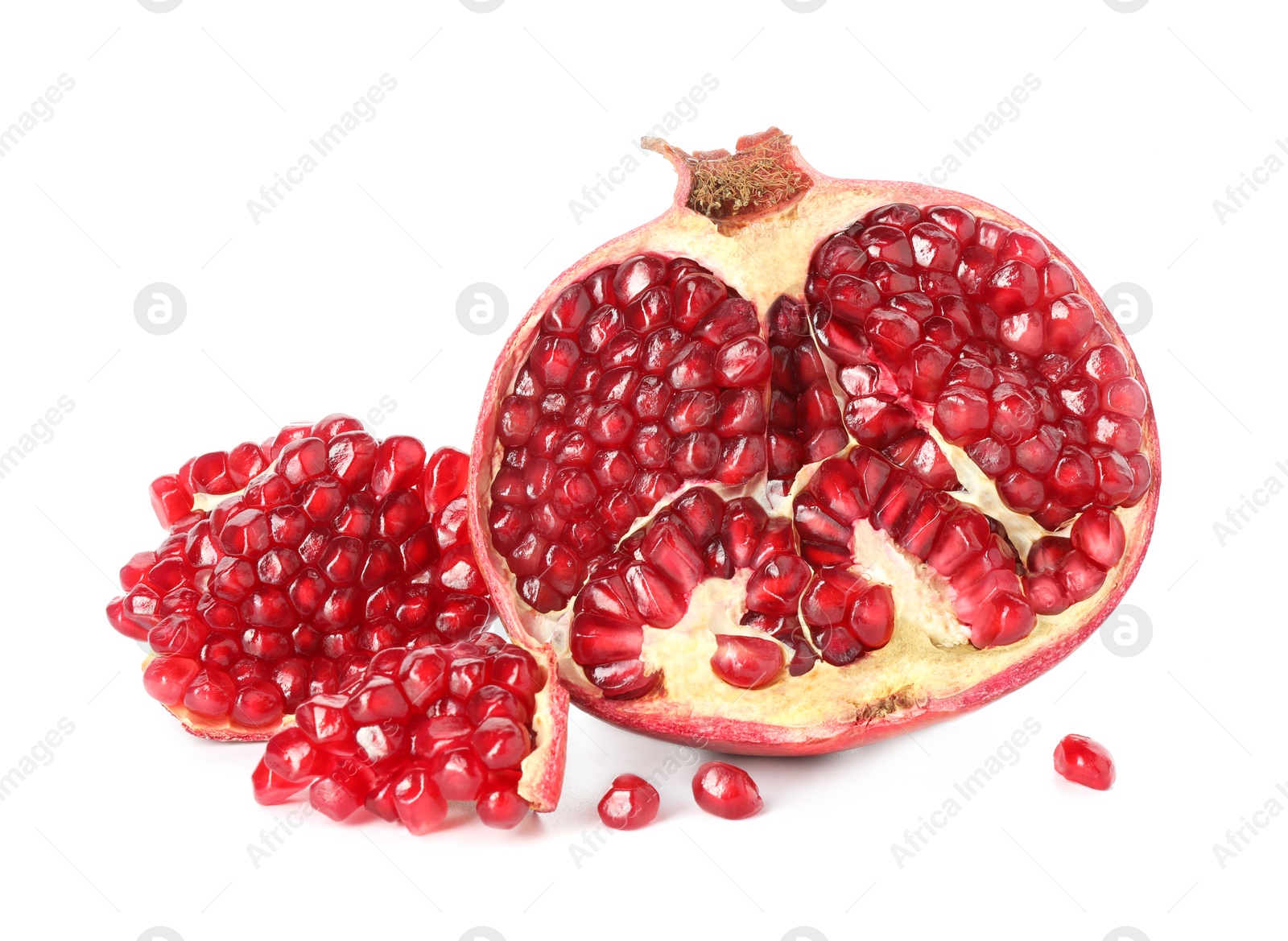 Photo of Fresh cut pomegranate with juicy seeds isolated on white