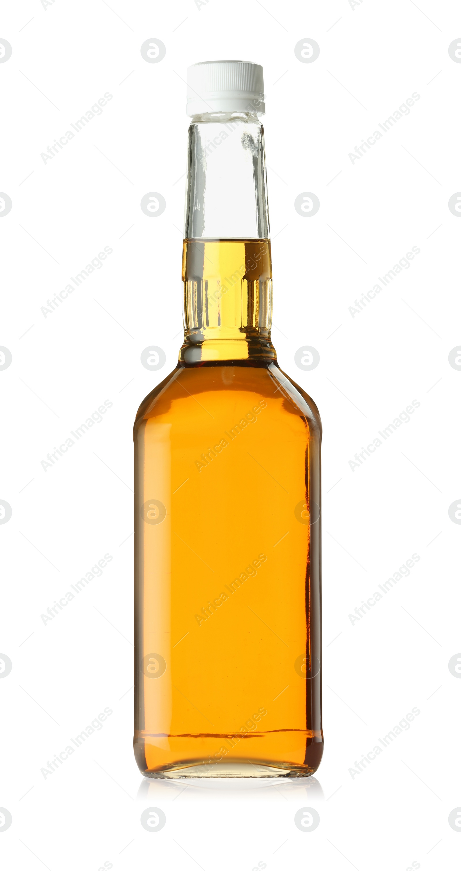 Photo of Whiskey in glass bottle isolated on white