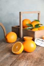 Fresh juicy oranges on wooden table. Healthy fruits