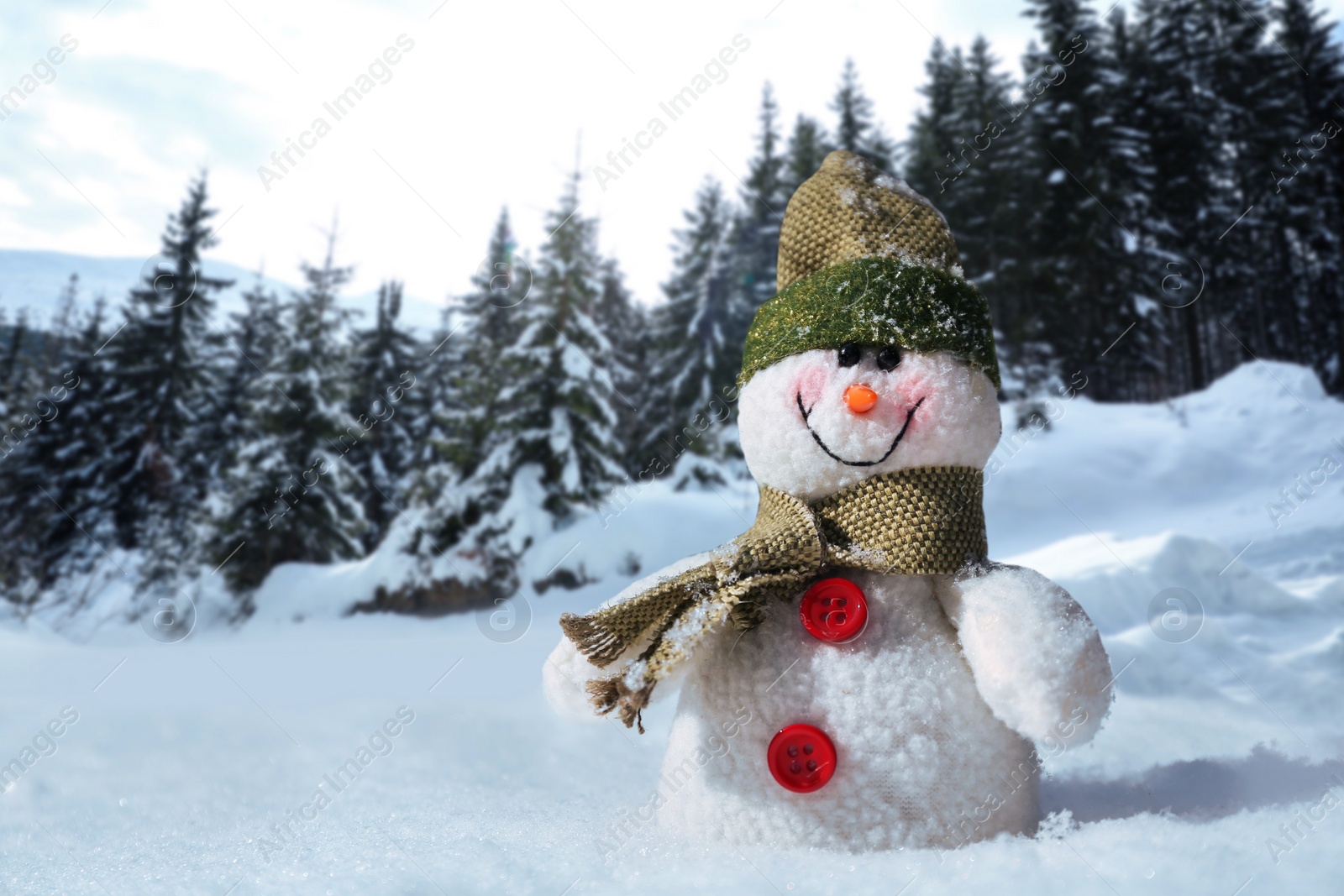 Image of Cute small decorative snowman outdoors on sunny day, space for text