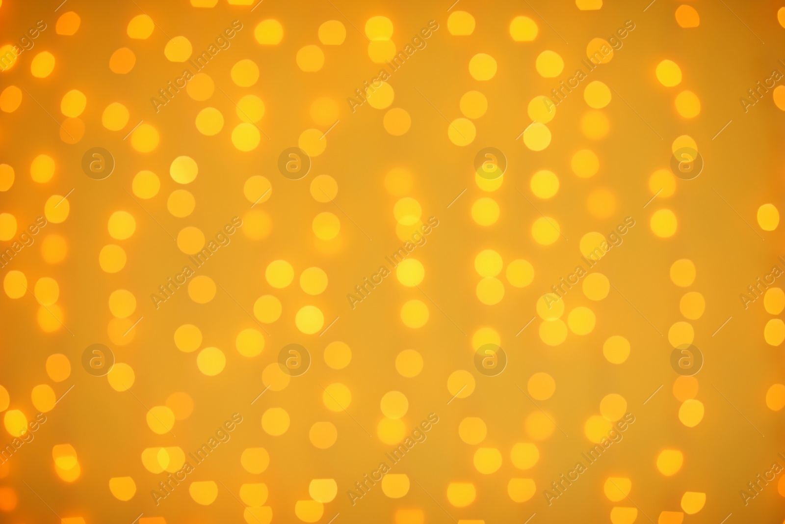 Photo of Beautiful gold lights as background. Bokeh effect