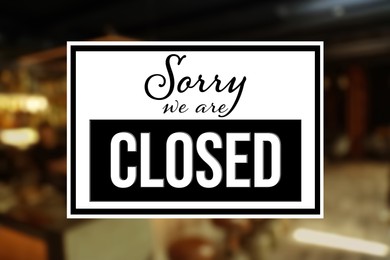 Sorry we are closed sign against blurred background