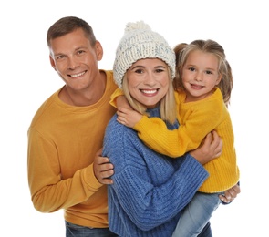 Photo of Happy family with daughter in warm sweaters on white background. Winter season