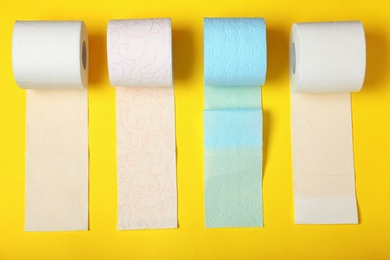 Flat lay composition with toilet paper on color background