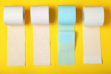 Photo of Flat lay composition with toilet paper on color background