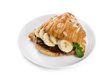 Delicious croissant with banana, chocolate and mint isolated on white