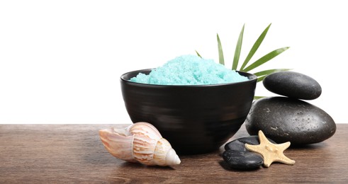 Photo of Light blue sea salt in bowl, spa stones, starfish, seashell and palm leaf on wooden table against white background. Space for text