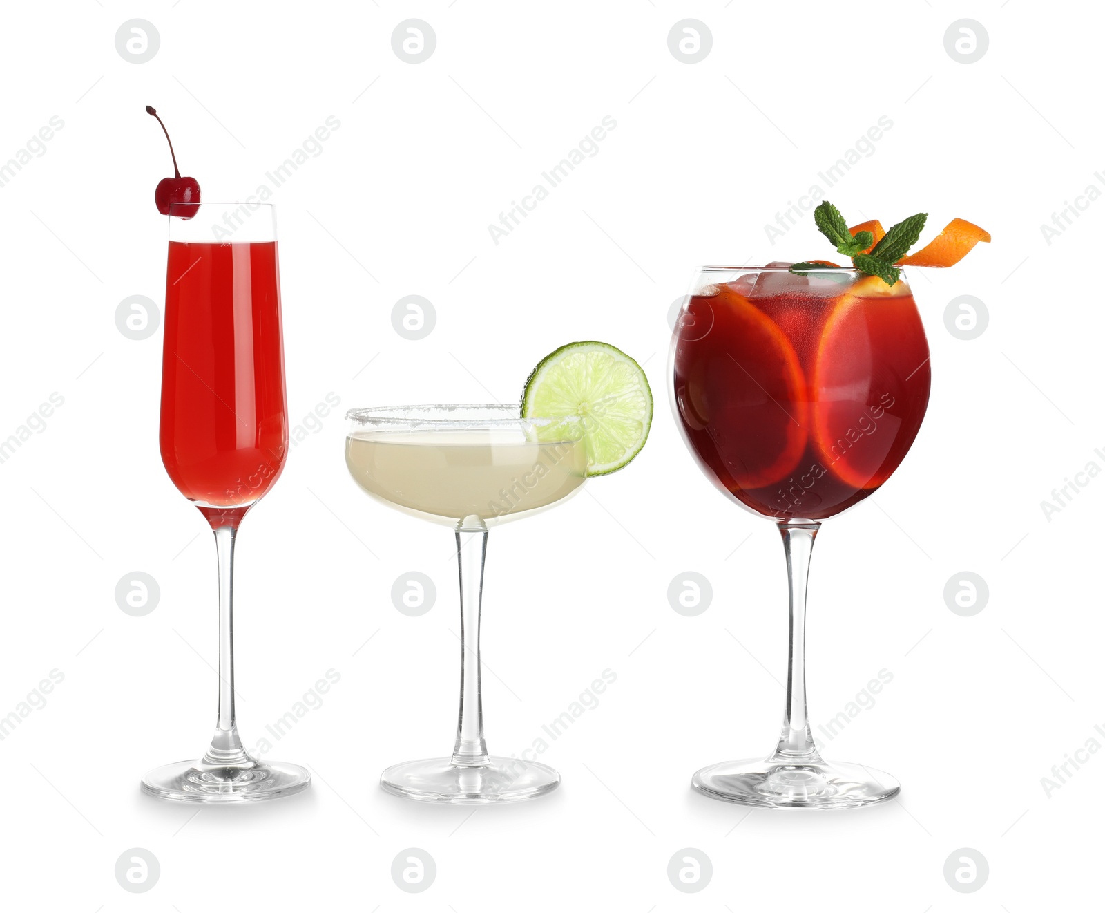 Photo of Glasses of traditional alcoholic cocktails on white background