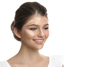 Photo of Beautiful girl on white background. Using concealer and foundation for face contouring