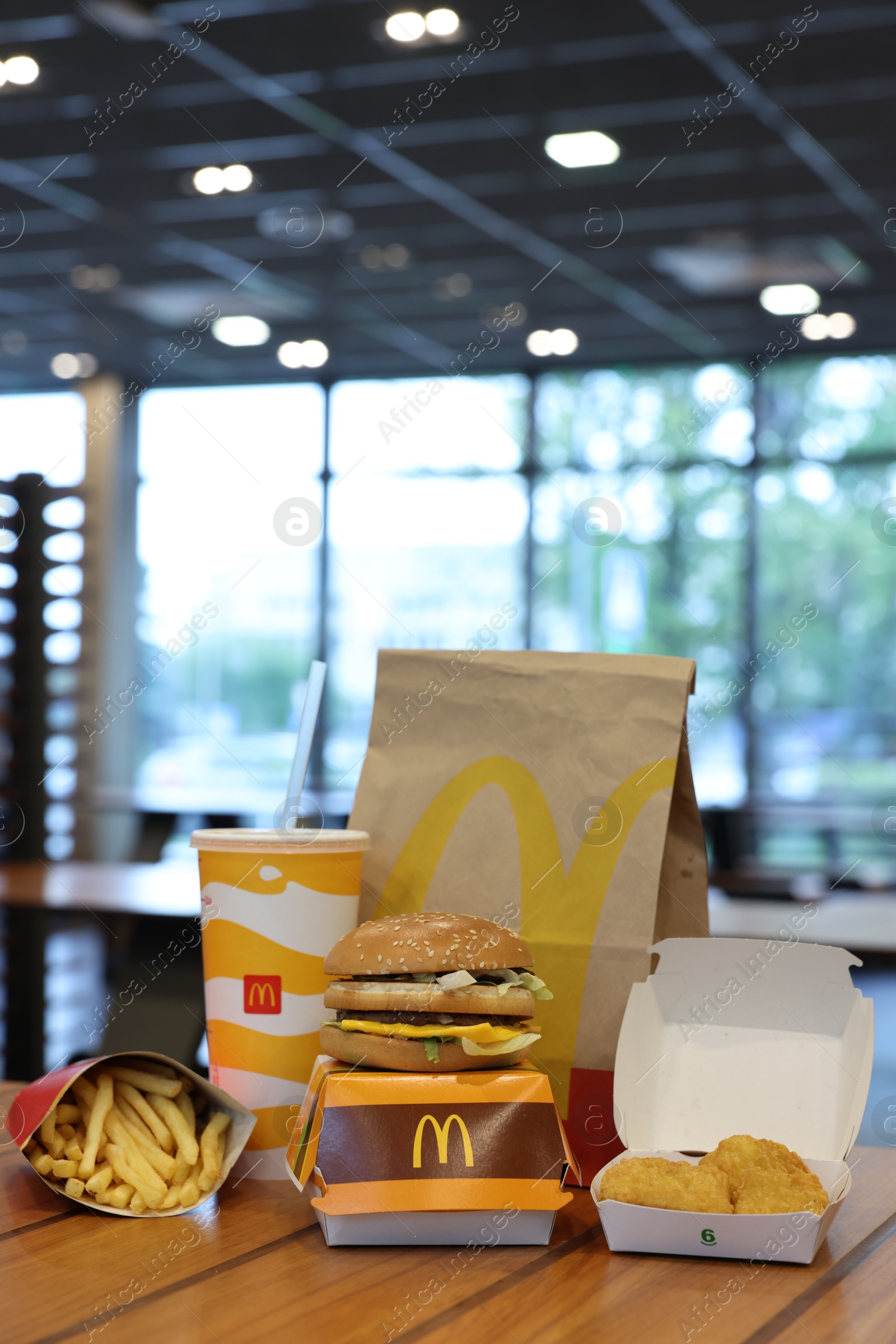 Photo of Lviv, Ukraine - October 9, 2023: McDonald's menu on wooden table in restaurant