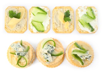 Image of Delicious crackers with different toppings isolated on white, top view