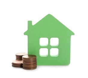 House model and coins on white background. Money saving concept