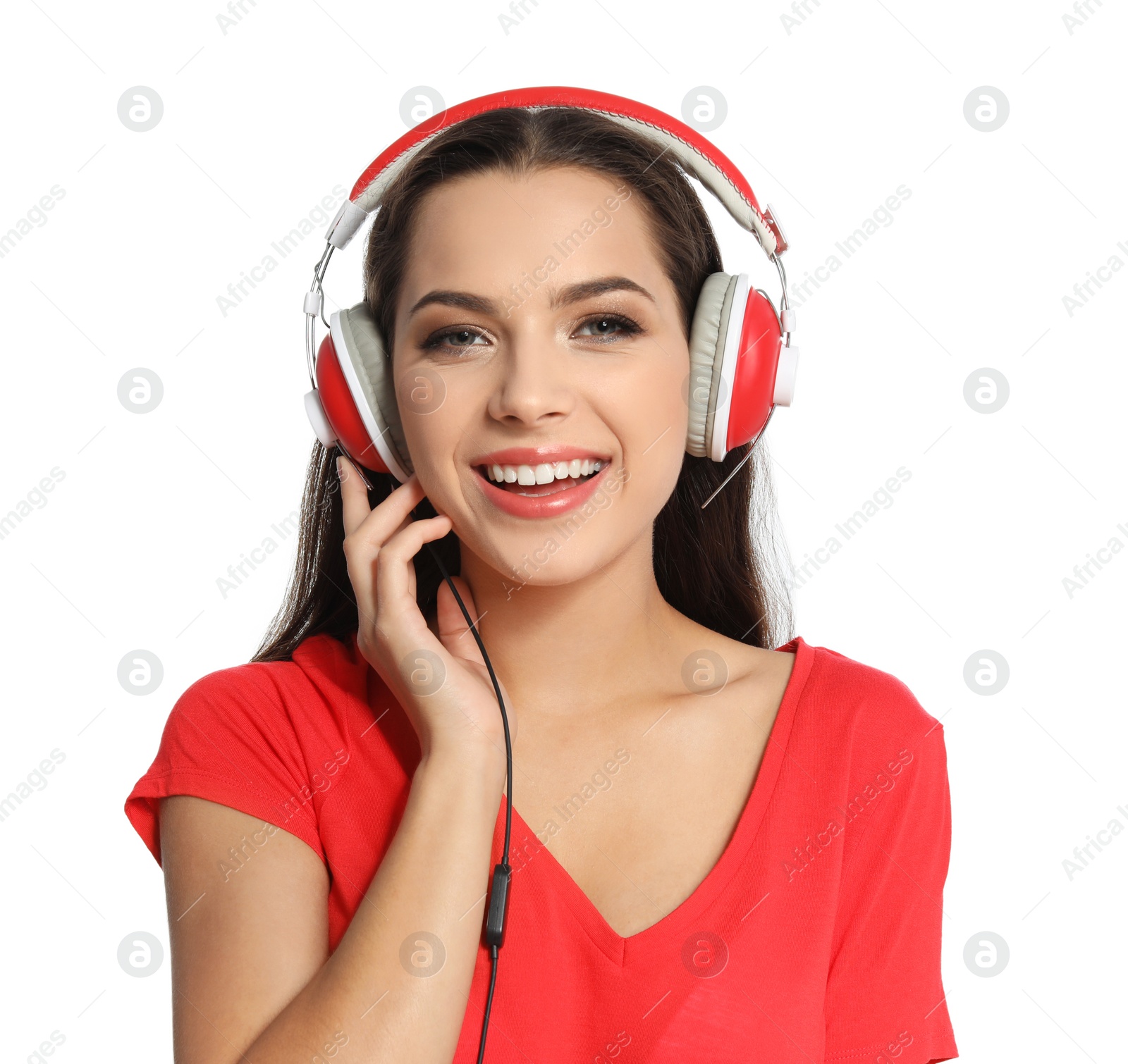 Photo of Young woman listening to Christmas music on white background