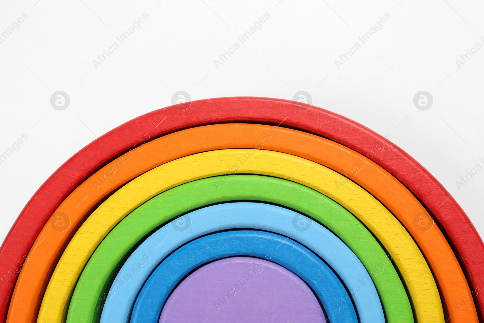 Photo of Rainbow on white background, top view. Children`s toy