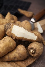 Photo of Tubers of turnip rooted chervil on table, closeup