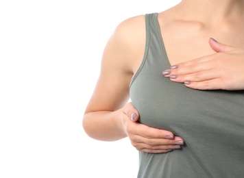 Photo of Woman checking her breast on white background, closeup. Space for text