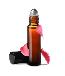 Image of Bottle of rose essential oil and flower petals on white background