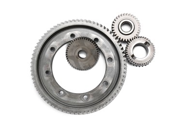 Different stainless steel gears on white background, top view