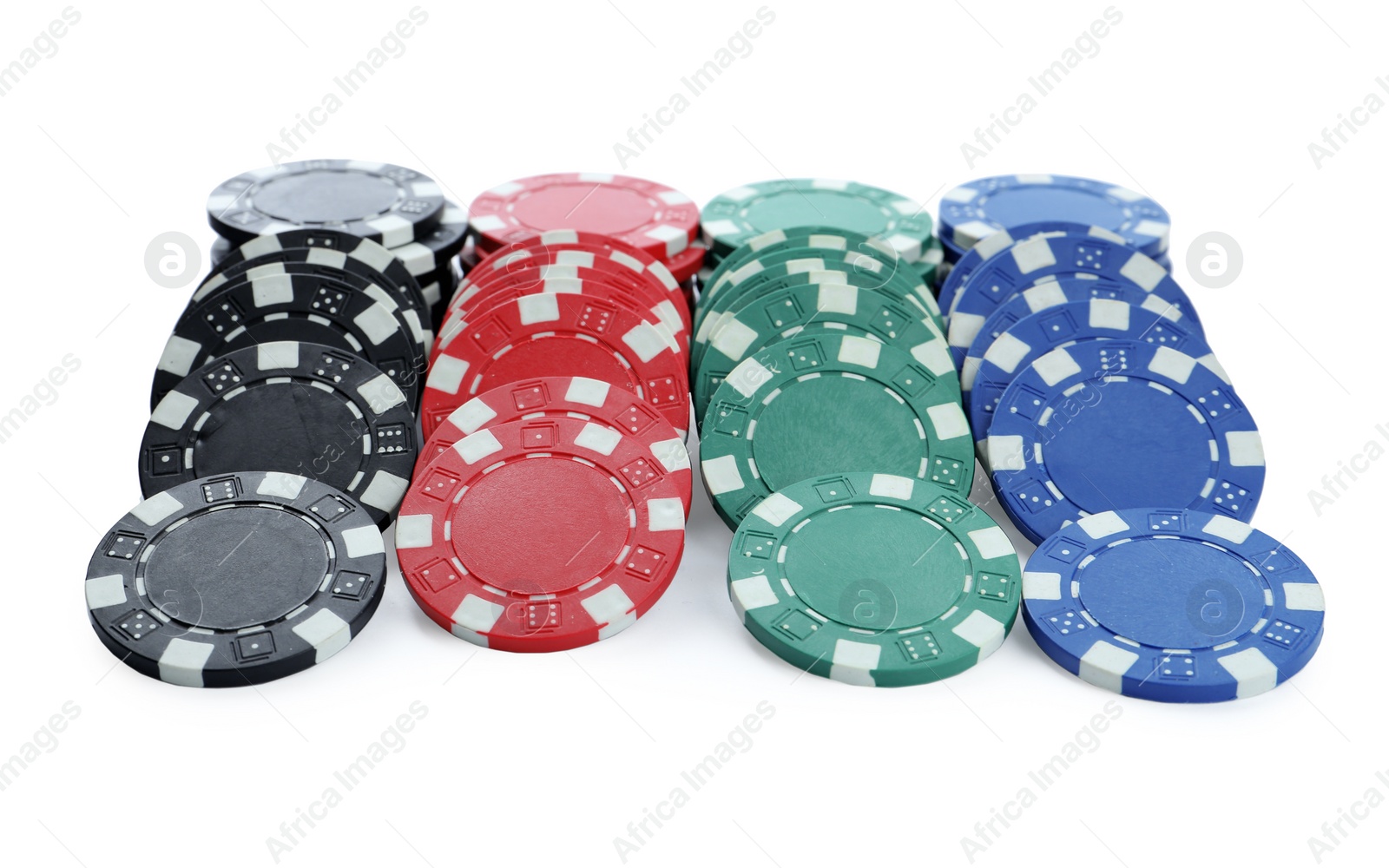 Photo of Plastic casino chips stacked on white background. Poker game