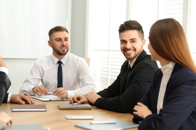 Photo of Professional business trainer working with people in office