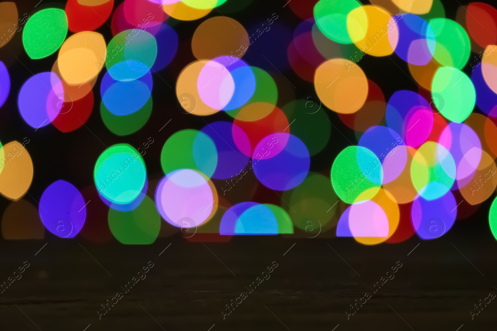 Photo of Empty wooden table against bokeh background. Mockup for design