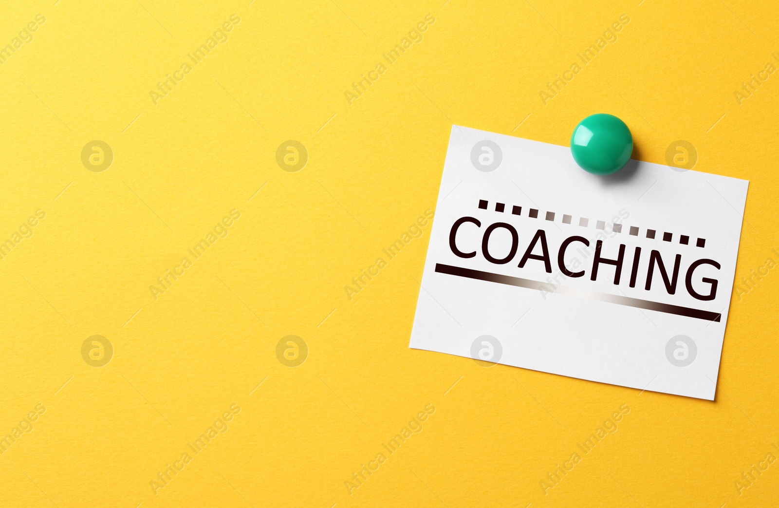 Image of Adult learning. Paper note with word COACHING on yellow background, space for text