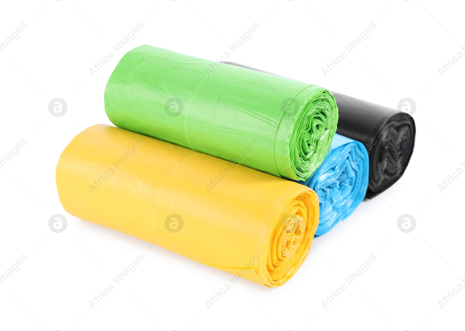 Photo of Rolls of colorful garbage bags isolated on white