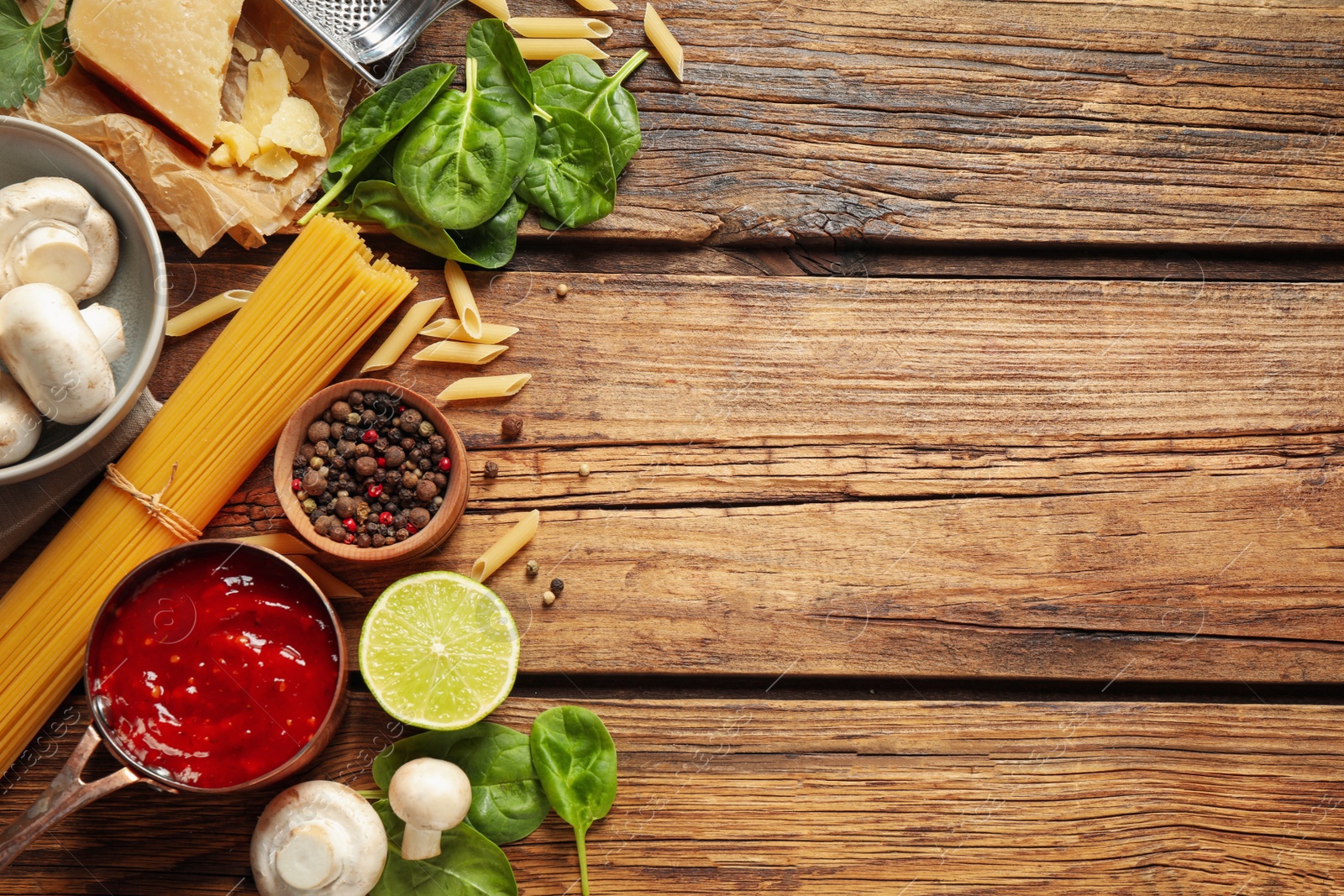 Photo of Flat lay composition with fresh products on wooden table, space for text. Healthy cooking