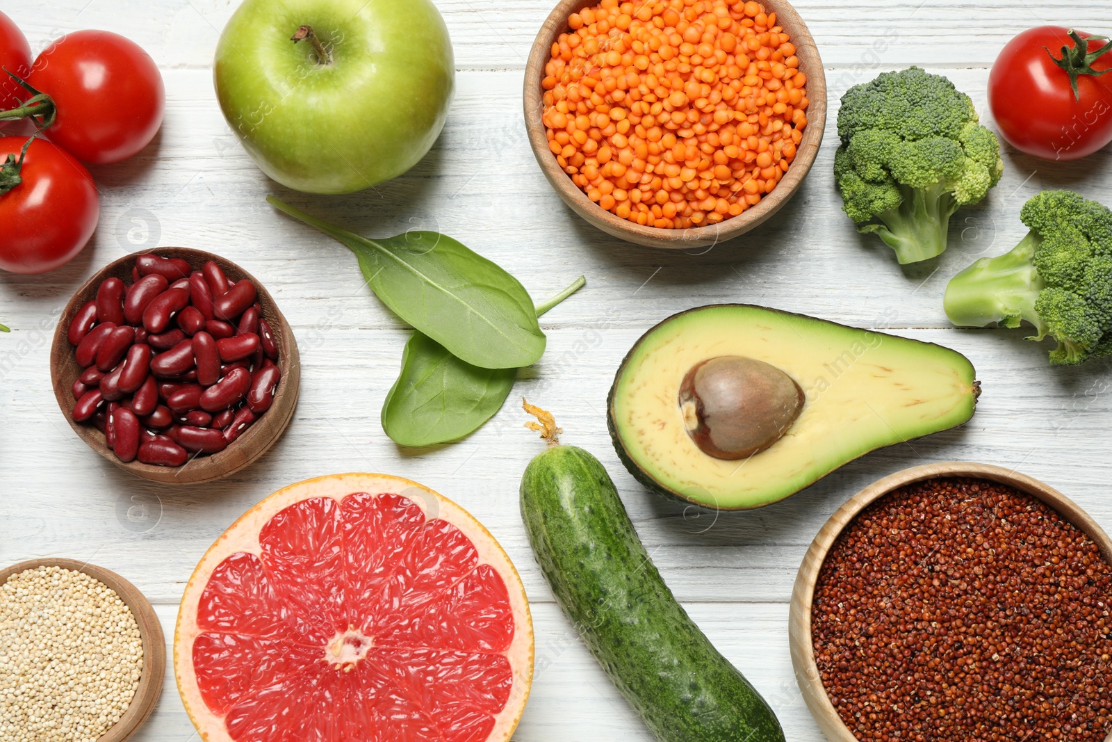 Photo of Different vegetables, seeds and fruits on white wooden table, flat lay. Healthy diet