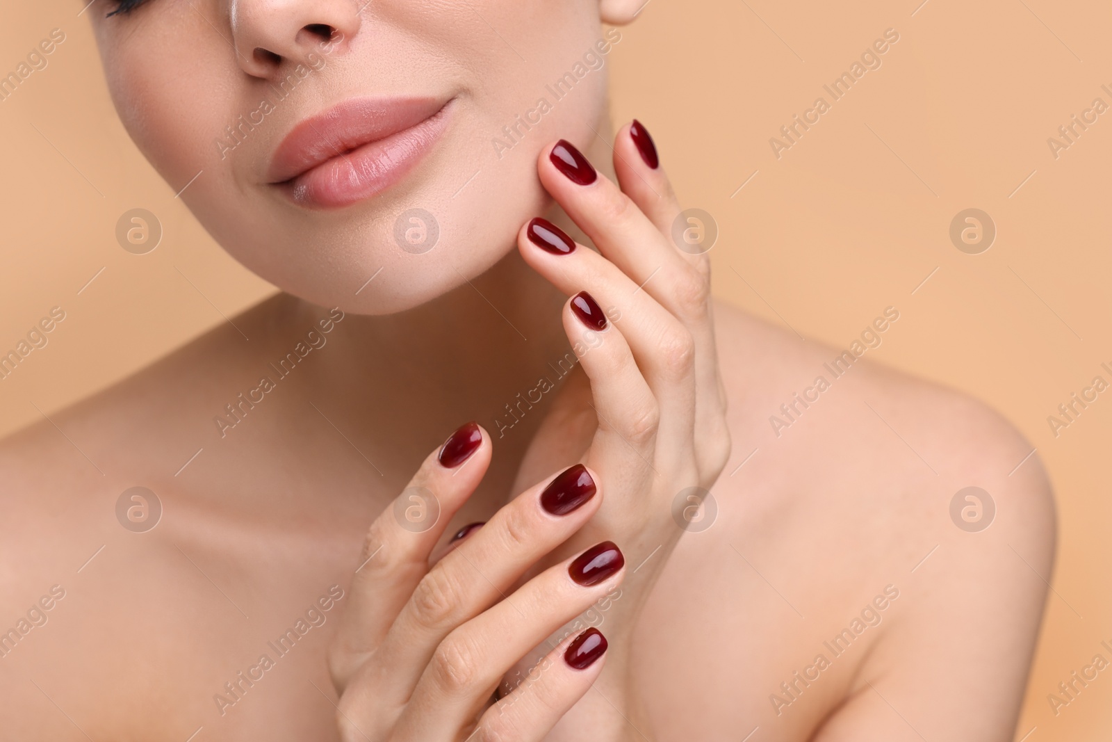 Photo of Woman with beautiful lips on beige background, closeup