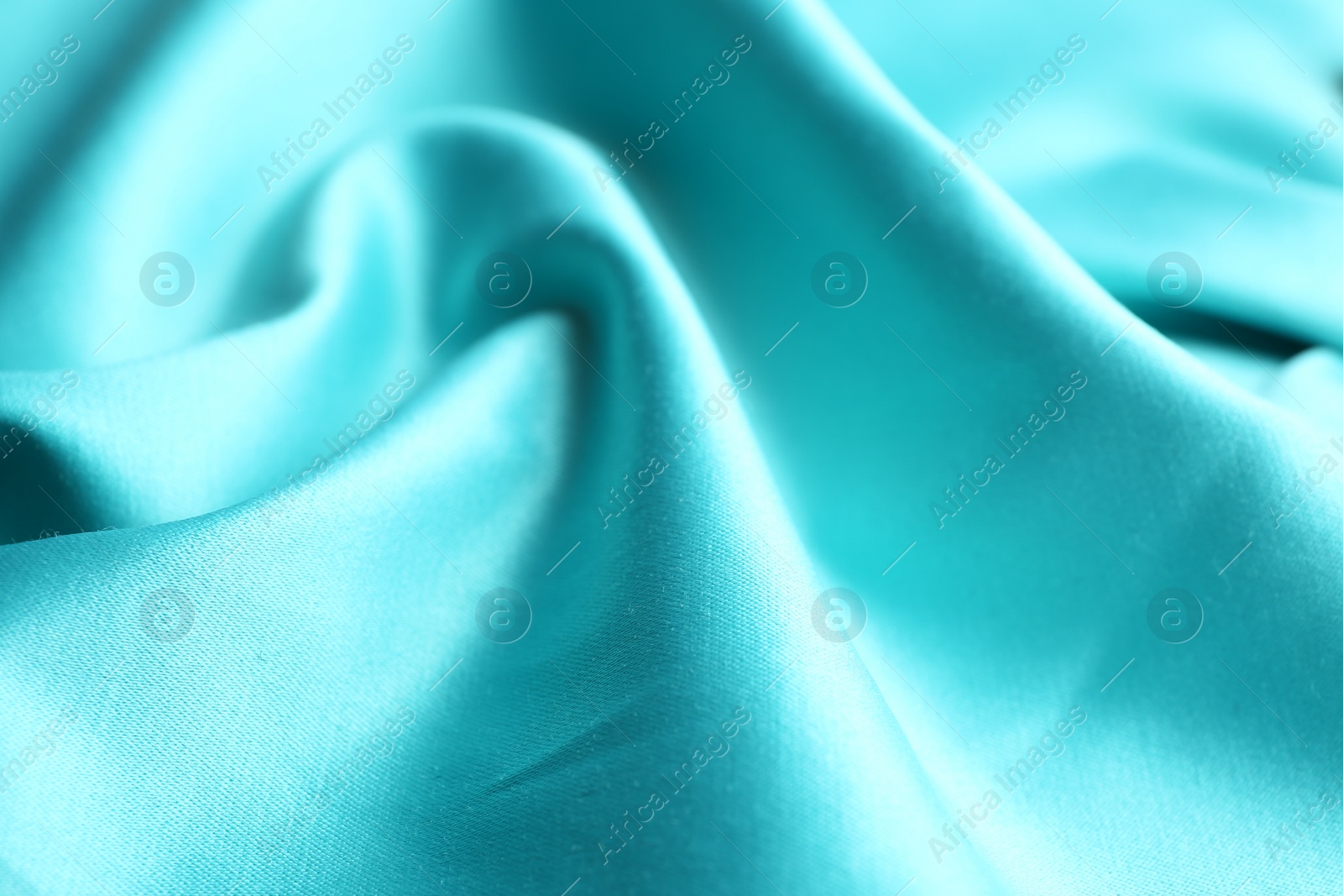 Photo of Texture of delicate light blue fabric as background, closeup