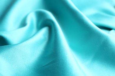 Texture of delicate light blue fabric as background, closeup